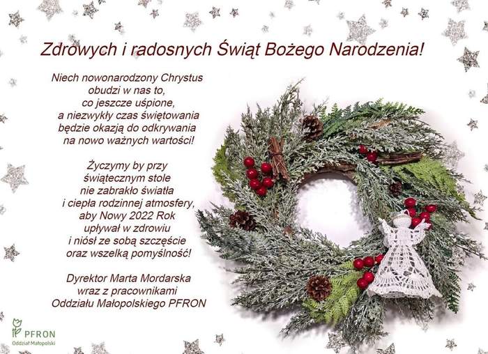 Życzenia z okazji Świąt Bożego Narodzenia od Dyrektor Marty Mordarskiej i pracowników Oddziału Małopolskiego PFRON. Obok życzeń zdjęcie świątecznego wieńca i koronkowego białego aniołka wykonanego przez koronczarki z PZG.
